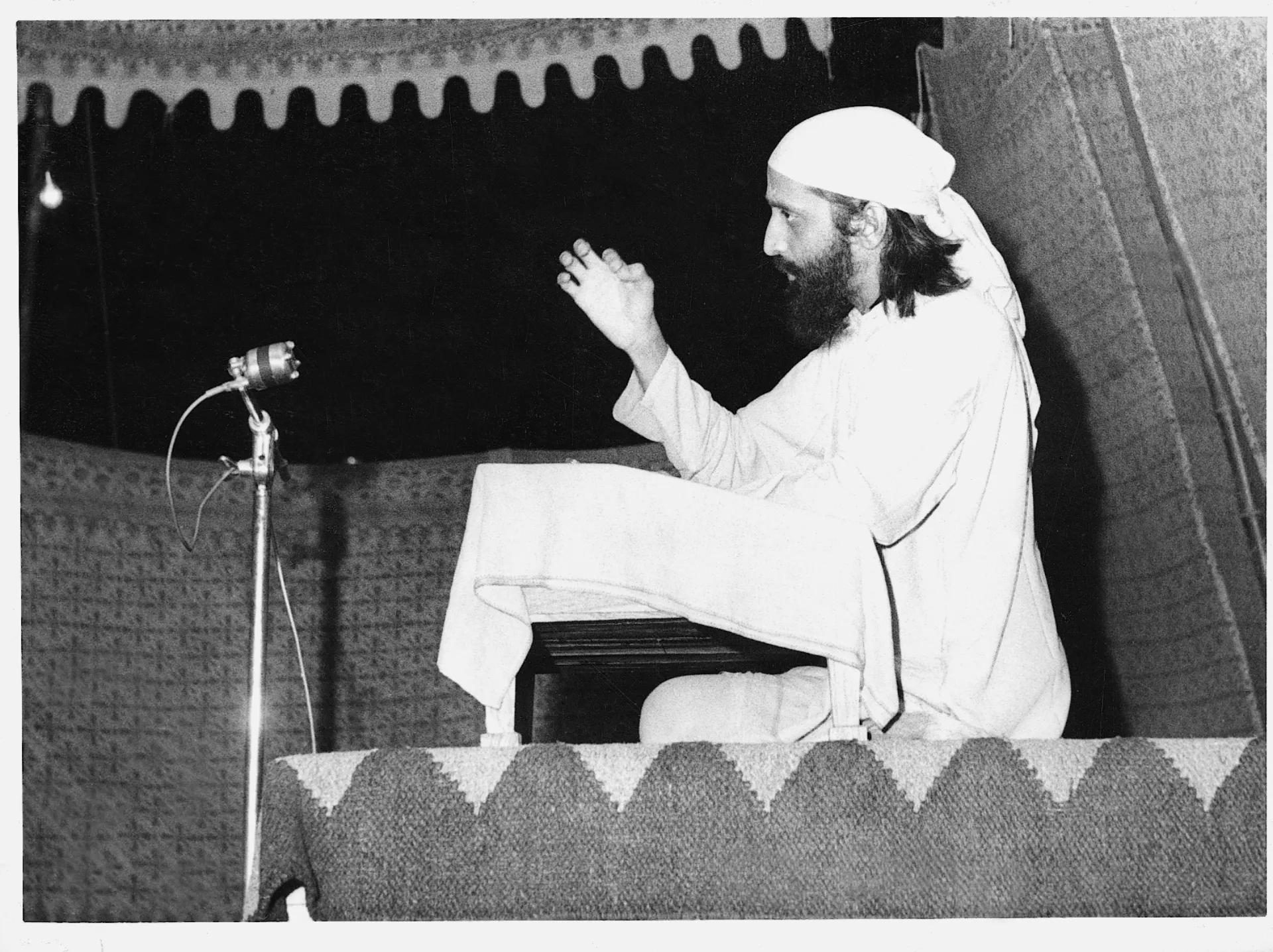 A speaker addressing a large CHYK audience