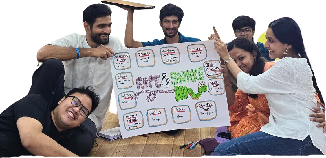 YEP trainees at a workshop, laughing over a board game they made